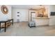 Clean kitchen, white cabinets, granite island, open to living room at 2511 Quincy S St, St Petersburg, FL 33711