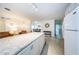 Granite countertop kitchen island with white cabinets at 2511 Quincy S St, St Petersburg, FL 33711