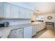 White kitchen cabinets and granite countertops at 2511 Quincy S St, St Petersburg, FL 33711
