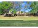 Private backyard with grassy area and fenced perimeter at 310 Summer Clouds Pl, Brandon, FL 33511