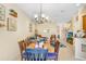 Bright dining area with a charming table and view into the living room at 310 Summer Clouds Pl, Brandon, FL 33511