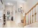 Light and bright entry hall with staircase and storage at 310 Summer Clouds Pl, Brandon, FL 33511