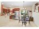 Bright kitchen with wood cabinets, breakfast nook, and backyard access at 310 Summer Clouds Pl, Brandon, FL 33511