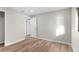 Bright bedroom with hardwood floors and an open door at 316 Shore E Dr, Oldsmar, FL 34677