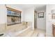 Relaxing bathroom with jetted tub and walk-in shower at 350 6Th N Ave, Tierra Verde, FL 33715