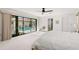 Bright bedroom with pool view and sliding glass doors at 350 6Th N Ave, Tierra Verde, FL 33715