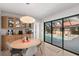 Dining area with round table, and large window overlooking pool at 350 6Th N Ave, Tierra Verde, FL 33715