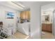 Laundry room with washer, dryer, and extra storage at 350 6Th N Ave, Tierra Verde, FL 33715