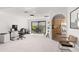 Bright home office space with built-in shelving and kitchen access at 350 6Th N Ave, Tierra Verde, FL 33715