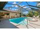 Inviting screened-in pool and spa area with plenty of space for relaxation at 350 6Th N Ave, Tierra Verde, FL 33715