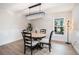 Bright dining room with chandelier, round table, and four chairs at 3933 Northridge Dr, Valrico, FL 33596