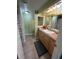 Clean bathroom with double sinks and a neutral color scheme at 400 Island Way # 309, Clearwater Beach, FL 33767