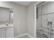 Clean bathroom with vanity and access to laundry at 4504 S Cameron Ave, Tampa, FL 33611