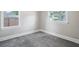 Simple bedroom with grey carpet and neutral walls at 4504 S Cameron Ave, Tampa, FL 33611