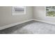 Simple bedroom with grey carpet and neutral walls at 4504 S Cameron Ave, Tampa, FL 33611