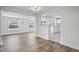 Open concept dining area with hardwood floors and views of the kitchen at 4504 S Cameron Ave, Tampa, FL 33611