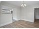 Bright dining room with hardwood floors and a chandelier at 4504 S Cameron Ave, Tampa, FL 33611
