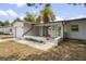 Front view of a house with a covered porch and well-maintained lawn at 4504 S Cameron Ave, Tampa, FL 33611