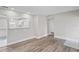 Open concept living space with kitchen bar and wood floors at 4504 S Cameron Ave, Tampa, FL 33611