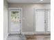 Backyard view from interior French doors with tile flooring at 4504 S Cameron Ave, Tampa, FL 33611
