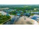 Aerial view of community clubhouse, pool, and marina on the waterfront at 615 Mirabay Blvd, Apollo Beach, FL 33572