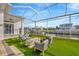 Spacious backyard patio with fire pit and artificial turf at 615 Mirabay Blvd, Apollo Beach, FL 33572