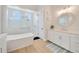 Elegant bathroom with a soaking tub and double vanity at 615 Mirabay Blvd, Apollo Beach, FL 33572