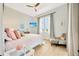 Relaxing bedroom with a queen bed, sitting chair, and beautiful window views at 615 Mirabay Blvd, Apollo Beach, FL 33572