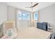 Bright bedroom with large windows, plush carpet, and ample space at 615 Mirabay Blvd, Apollo Beach, FL 33572