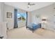 Cozy bedroom featuring a twin bed, large window, and nautical decor at 615 Mirabay Blvd, Apollo Beach, FL 33572