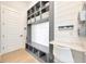 Functional entryway with built-in bench seating, cubbies, and a workspace at 615 Mirabay Blvd, Apollo Beach, FL 33572
