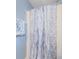 Bathroom showing the blue marble-patterned shower curtain at 6254 Pershing Ne St, St Petersburg, FL 33702
