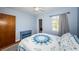 Bedroom featuring blue accents and a closet view, blending style with functionality for comfortable living at 6254 Pershing Ne St, St Petersburg, FL 33702