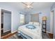 Comfortable bedroom with a window and blue patterned bedding, creating a serene and inviting space at 6254 Pershing Ne St, St Petersburg, FL 33702