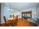 Dining room with modern lighting fixtures and hardwood floors, perfect for Gathering meals at 6254 Pershing Ne St, St Petersburg, FL 33702
