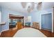 Open-concept dining area with light blue walls that connects to the living area, enhancing the sense of space at 6254 Pershing Ne St, St Petersburg, FL 33702