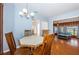 Bright dining area with a view into the kitchen and the living room creates an inviting atmosphere at 6254 Pershing Ne St, St Petersburg, FL 33702