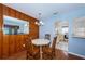 Dining room flowing into a bright kitchen with white appliances, creating an easy flow for entertaining at 6254 Pershing Ne St, St Petersburg, FL 33702