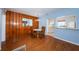 Dining room with modern lighting fixtures and hardwood floors, perfect for Gathering meals at 6254 Pershing Ne St, St Petersburg, FL 33702