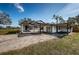 This single-story home features a connected carport and cozy covered porch at 6254 Pershing Ne St, St Petersburg, FL 33702