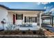 Cozy covered front porch with rocking chairs, perfect for relaxing and enjoying the neighborhood view at 6254 Pershing Ne St, St Petersburg, FL 33702