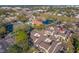 Aerial view of the townhome community featuring a pool, tennis courts, and pond at 6262 142Nd N Ave # 603, Clearwater, FL 33760