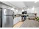 Modern kitchen featuring stainless steel appliances, granite countertops, and tile flooring at 6262 142Nd N Ave # 603, Clearwater, FL 33760