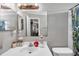 Clean bathroom with white vanity, shower, and patterned curtain at 652 13Th S Ave, St Petersburg, FL 33701