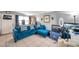 Living Room with blue sectional sofa and fireplace at 652 13Th S Ave, St Petersburg, FL 33701