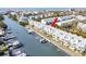 Aerial view of waterfront property with boat slips at 657 Garland Cir, Indian Rocks Beach, FL 33785