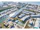 Aerial view of waterfront community with tennis court and pool at 657 Garland Cir, Indian Rocks Beach, FL 33785