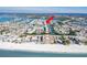 Aerial perspective highlighting beach proximity and canal access at 657 Garland Cir, Indian Rocks Beach, FL 33785