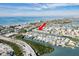Aerial view of waterfront property with resort-style amenities at 657 Garland Cir, Indian Rocks Beach, FL 33785