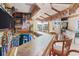 Long bar with seating, TVs, and ocean-themed decor at 657 Garland Cir, Indian Rocks Beach, FL 33785